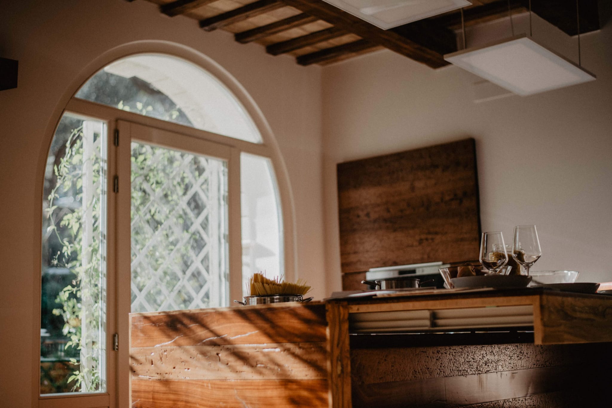 Apartment kitchen beneath an arched window
