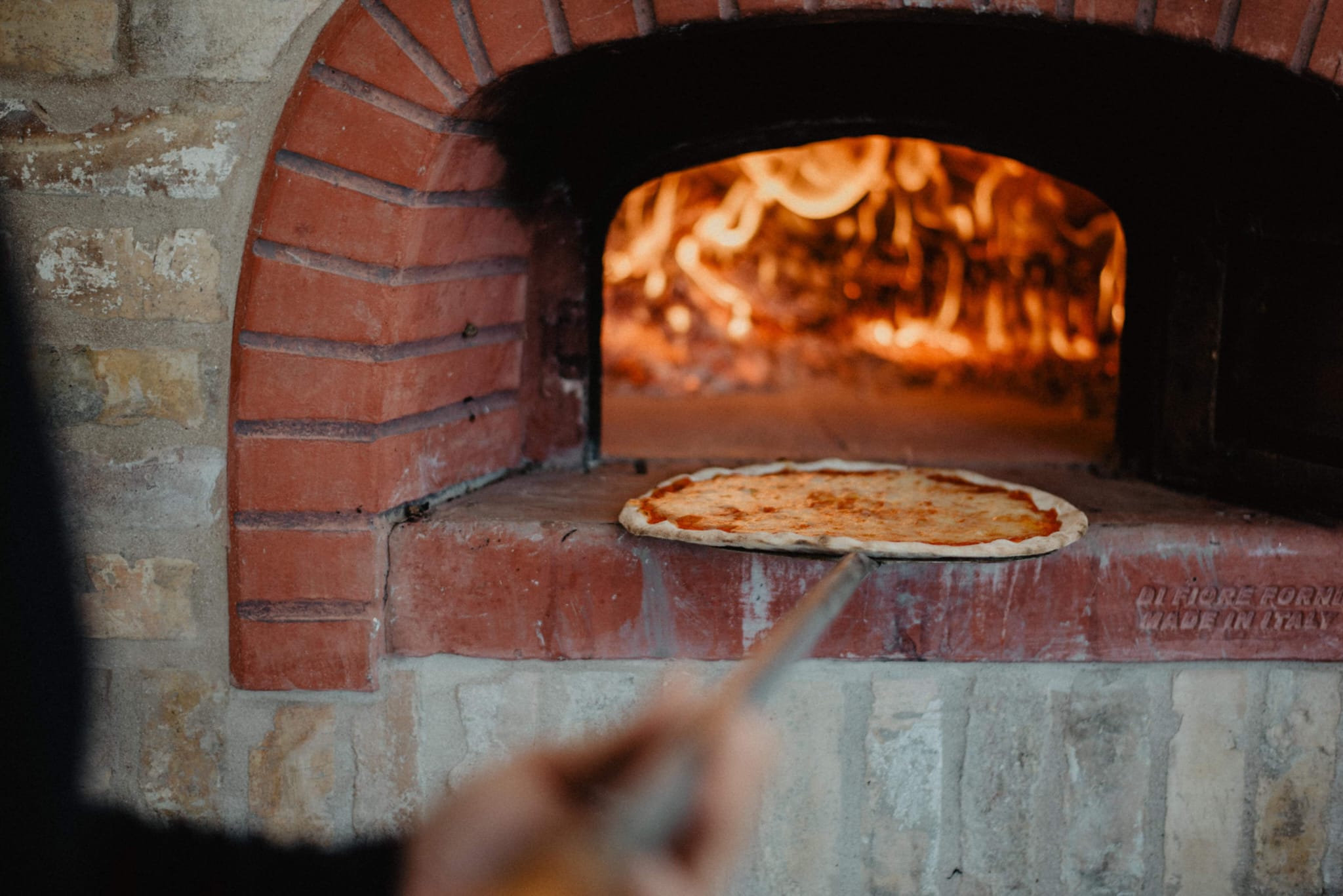 Pizza in the wood-fired oven
